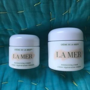 Two empty Creme de La Mer jars